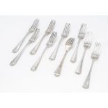 A set of nine George III silver dinner forks by Solomon Hougham, Old English pattern, with family