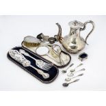 A collection of silver and silver plate, including four napkin rings, tea and coffee spoons, a