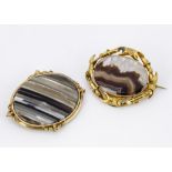 Two 19th Century agate and pinchbeck oval framed brooches, one with boxed back, 8cm x 6.5cm, the