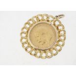 A George V half gold sovereign, dated 1912, in a yellow metal circular pendant mount, 7.7g