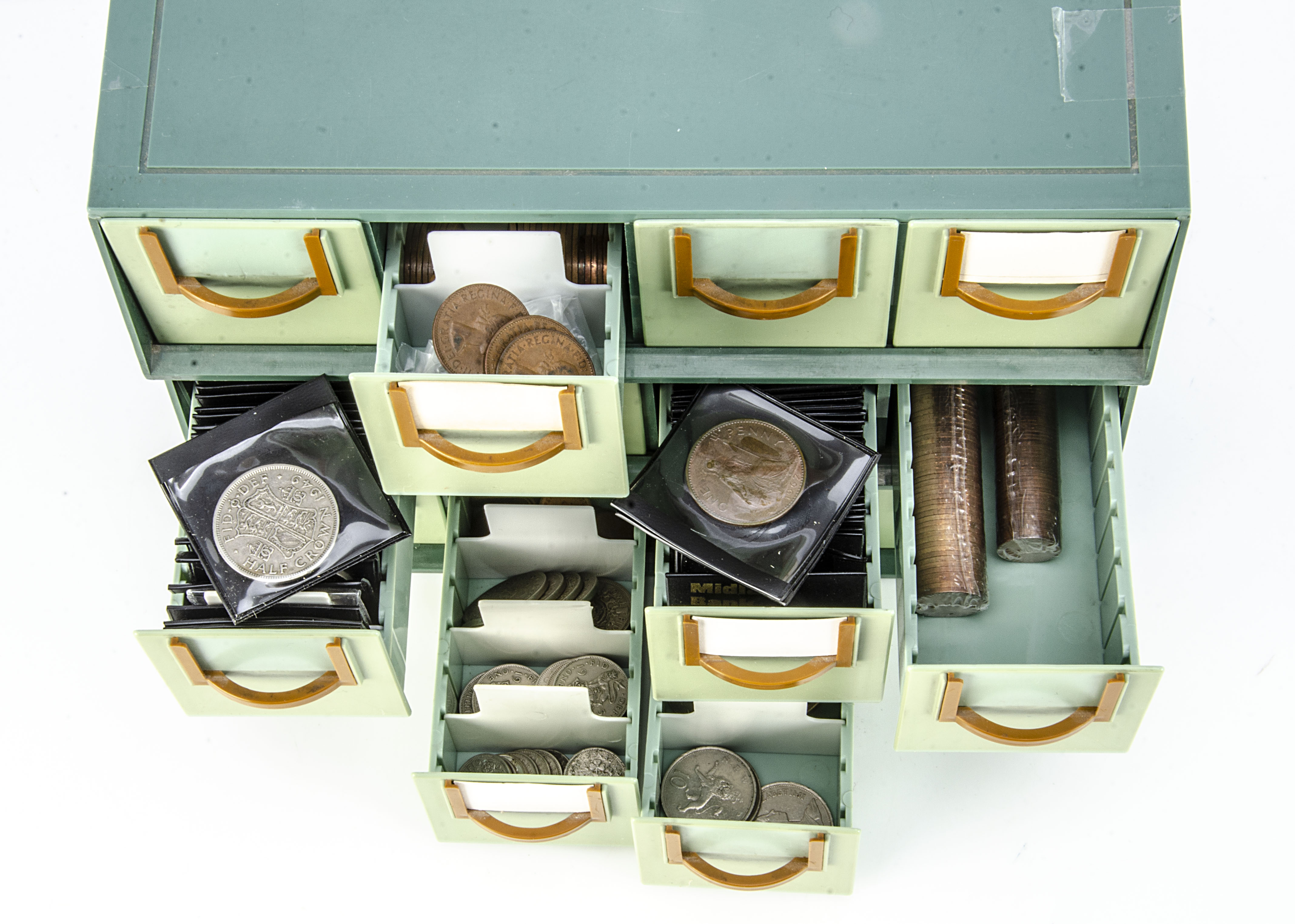 A collection of British coins, presented in three plastic units with four drawers, list of coins