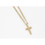 A continental yellow metal flattened curb linked chain, with crucifix pendant, all marked 750,