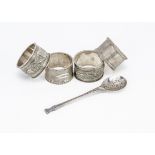 Two pairs of napkin rings and a spoon, one pair of 1940s examples with Lawrie & Joan engraved, the