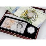 Two Royal Mint Bank Note and Coin sets, including a £10 note and silver crown in box with