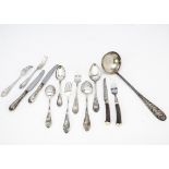 A part canteen of Russian silver plated cutlery, together with a similar soup ladle and antler style