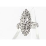 A French diamond set dress ring, of navette shape with a central band of claw set brilliant cut