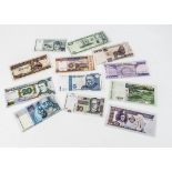 Twelve World bank notes, including 100 from Afghanistan, 2000 shillings from Tanzania, 10 from