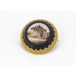 An Italian 19th Century micro mosaic and yellow metal circular brooch, with central panel of