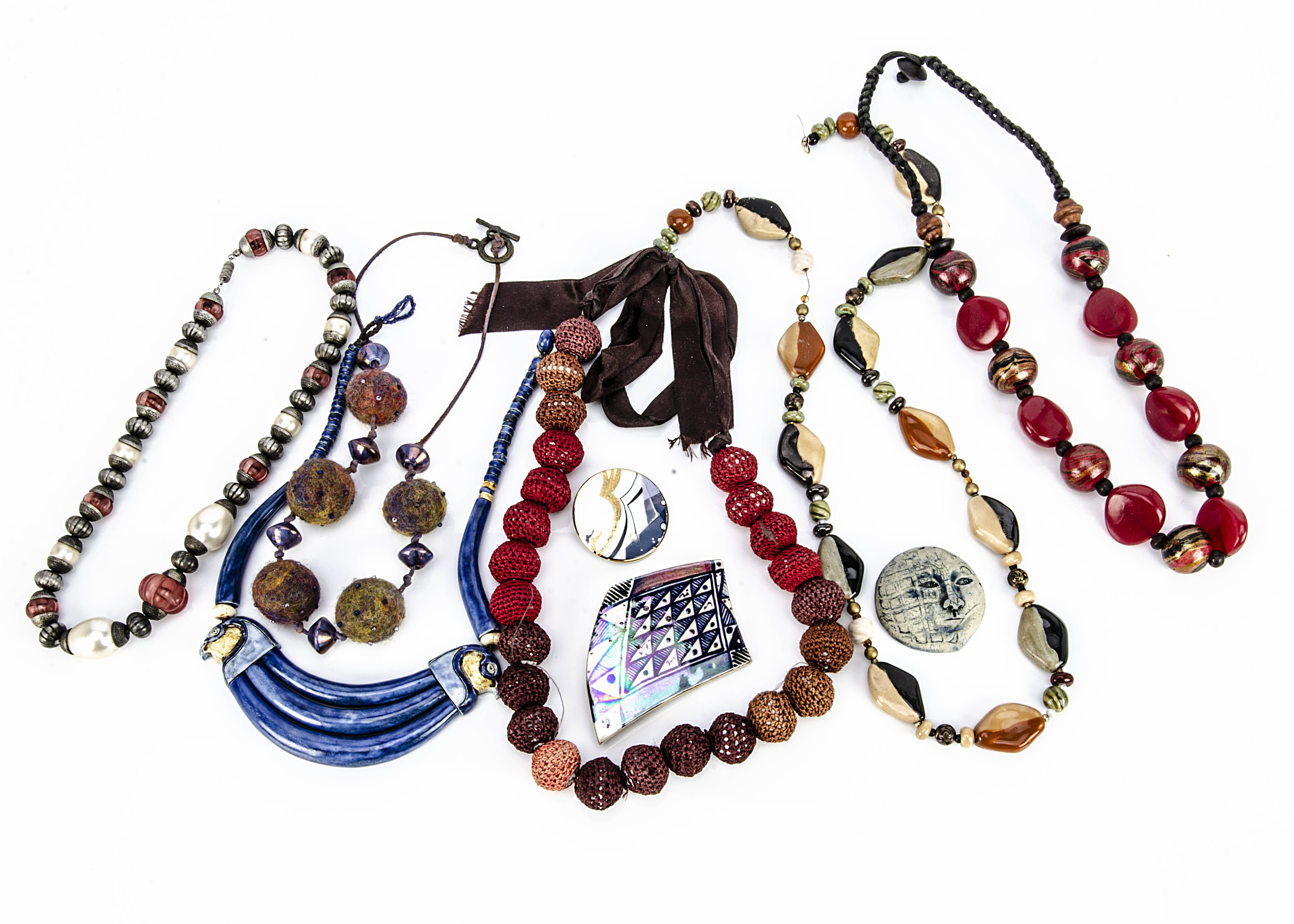 Various Middle Eastern and North African jewels and beads, together with a collection of ceramic and