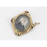 A 19th Century portrait miniature and yellow metal brooch, depicting three quarter length portrait