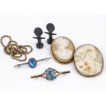 Two oval shell cameos, in gilt metal frames, a silver butterfly wing brooch, two miniature Wembley
