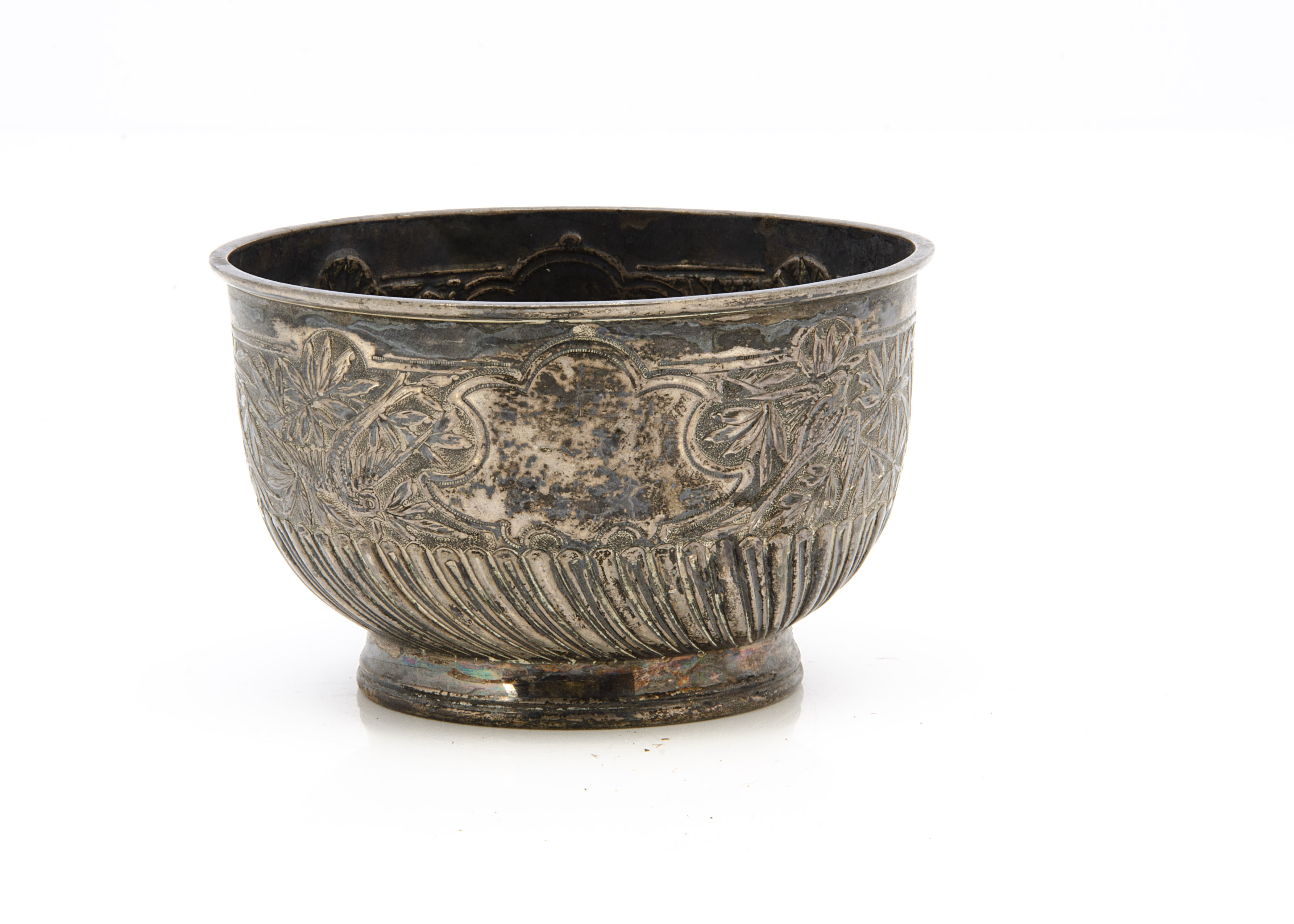 A Victorian silver sugar basin by Edward Hutton, circular footed bowl with raised design, 4.1 ozt,