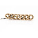 A 15ct gold and steel pin curb link bar brooch, 4.5cm long, 4g