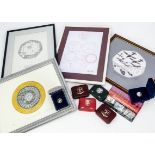 A collection of Isle of Man modern coins and other items, including several stamp presentation