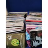 Three hard plastic singles cases, filled with various 45 vinyl singles