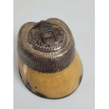 A Victorian military horses hoof paperweight, the chased silver mounting with silver horseshoe