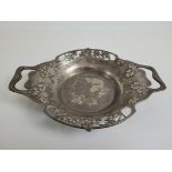 A Tudric Liberty twin handled pewter serving bowl, with pierced clover and heart design, impressed
