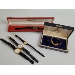 A small collection of lady's wristwatches, including a 9ct gold Tissot, with graduated textured