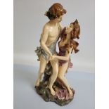 A large resin figurine of a pair of classical lovers in a dance, painted in colours, 43cm high
