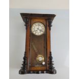 An early 20th Century Vienna regulator wall clock, eight day movement, white face, roman numerals,