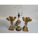 A pair of resin four branch gilt and floral candlesticks, 25cm high together with a porcelain floral