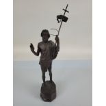 A 19th Century bronzed figure modelled as St John standing with staff and flag, bearing the legend