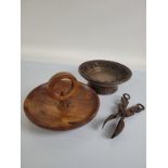 A Black Forest carved musical fruit bowl, with four airs, the carved bowl with edelweiss flowers