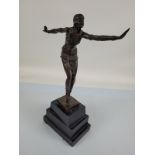 A reproduction bronze figure after Dimitri Chiparus, dancing flapper girl on black slate stepped