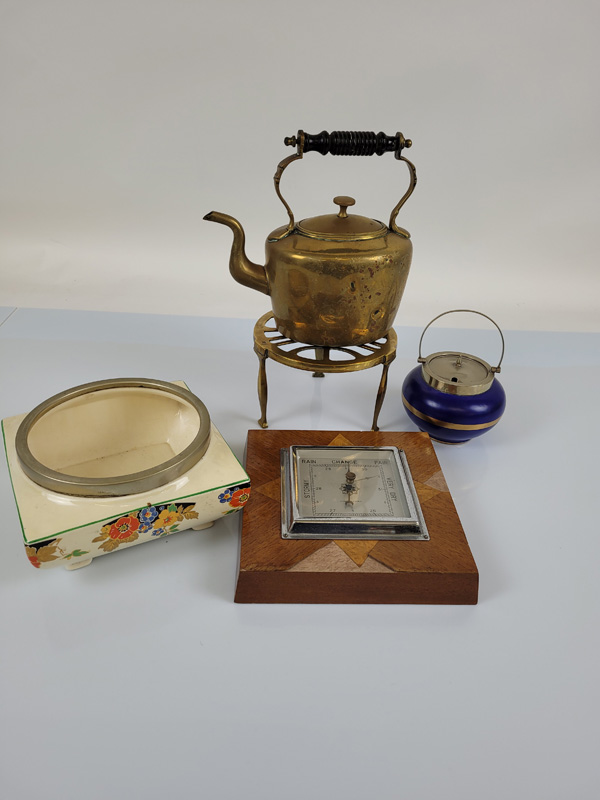 A collection of Art Deco ceramics, including a sugar bowl, fruit bowl and walnut veneered wall