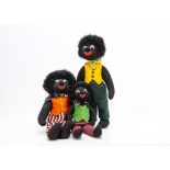 Three Robin Rive Gollies, in felt waistcoats with seam labels --17½in. (44.5cm.) high