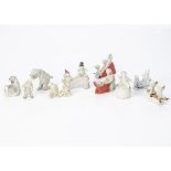 Ten bisque Snow Babies and other frosted pieces, two babies riding a 1st World War tank --2¼in. (