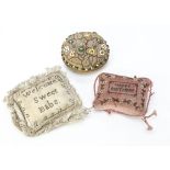 A 19th century Christening pin cushion, pricked out in pins, one side 'Welcome Sweet Baby' and the