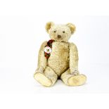 Pricey a large and fine Farnell teddy bear circa 1920, with blonde mohair, clear and black glass