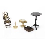 Early dolls' house pieces, a black painted circular occasional table with gold lining, turned