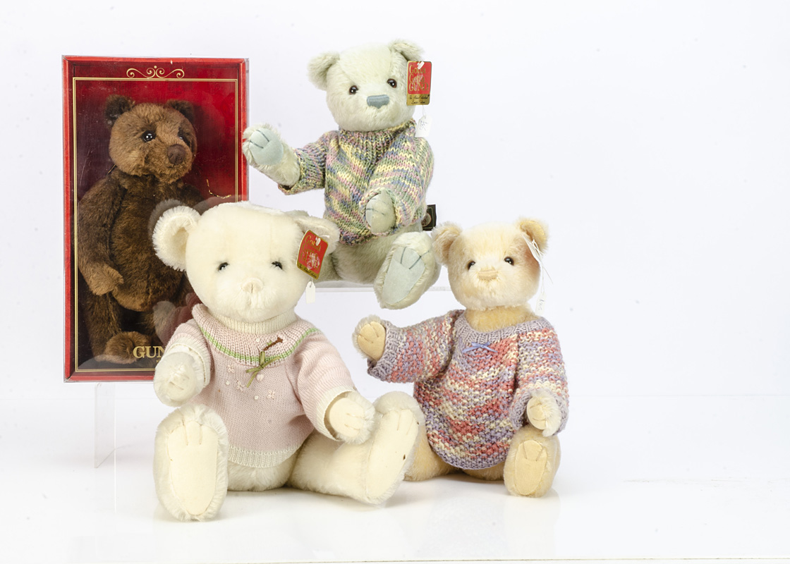 Four Gund jointed teddy bears, a pale green Caroline in knitted jumper --14in. (35.5cm.) high; a