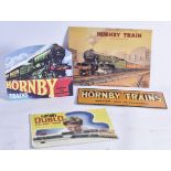 Hornby Dublo and 0 Gauge reproduction shop signs in card and tinplate. one Hornby Dublo and two 0