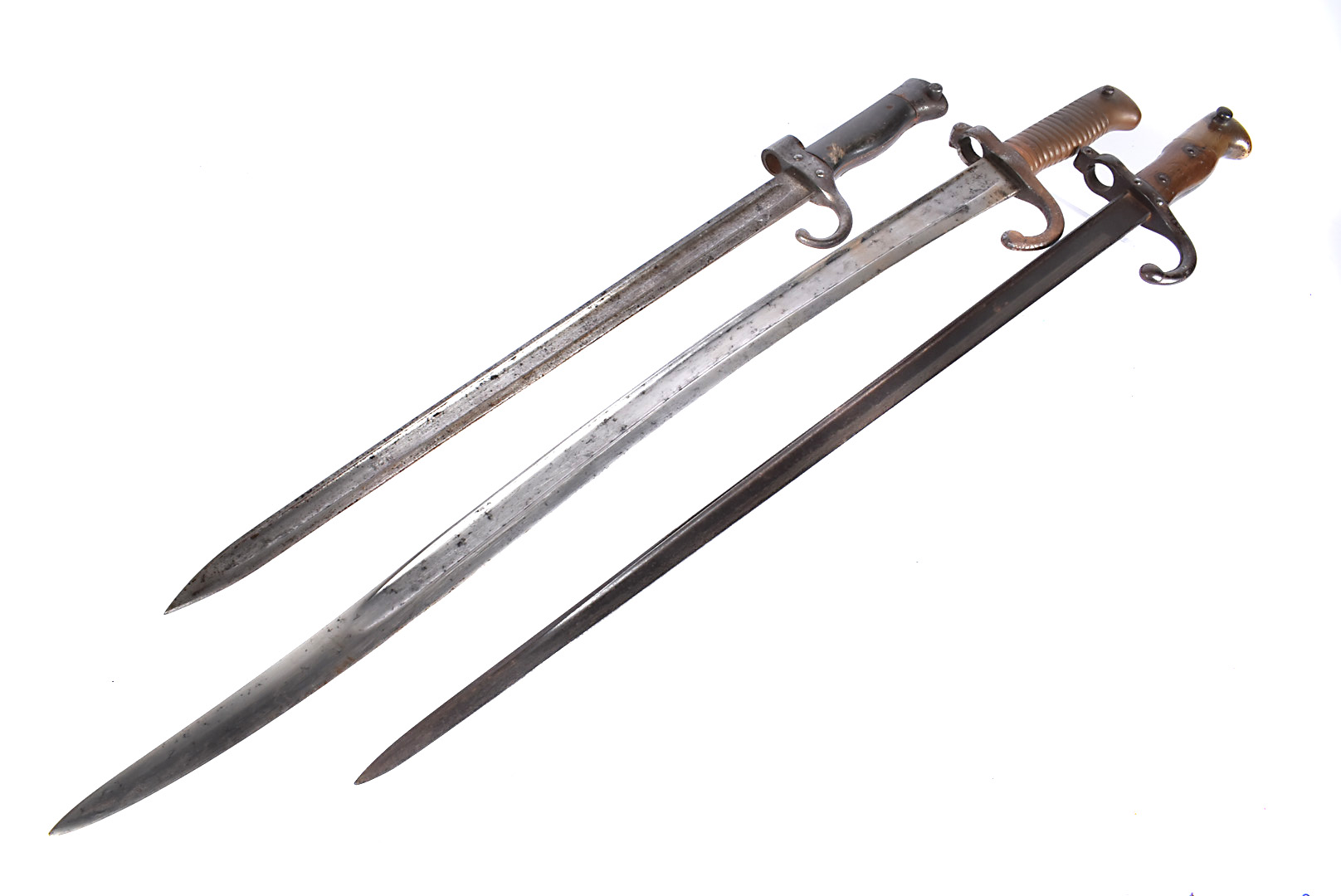 A group of three French Bayonets with scabbards, to include a Gras, serial 14795, scabbard serial