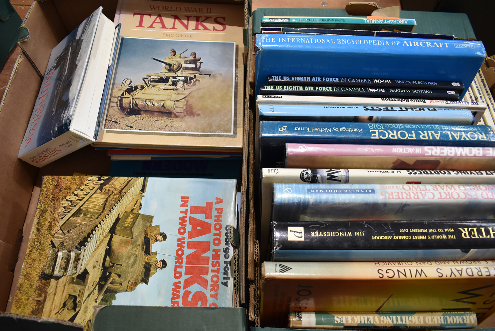 A collection of military vehicle related books, covering Army, Navy and Air Force, for different