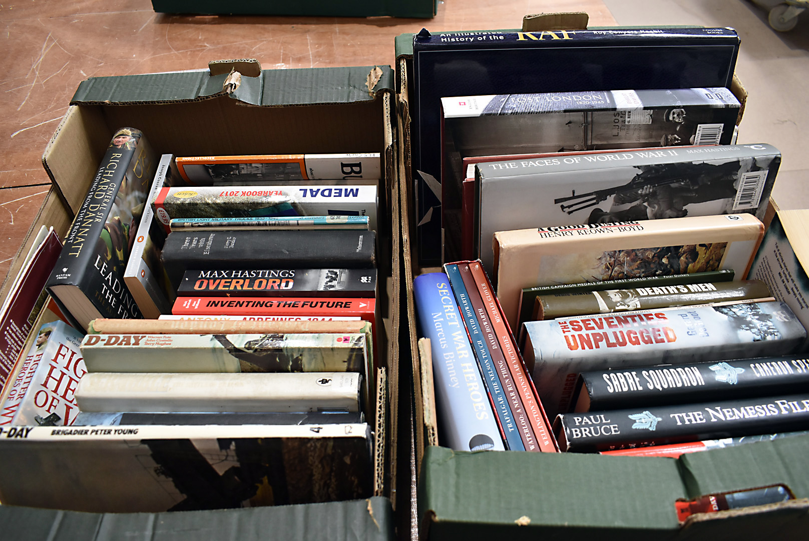 A large collection of military related books, to include, The Nemesis File by Paul Bruce, Sabre