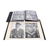 A selection of WWII German black and white photographs, depicting German troops, Hitler, various