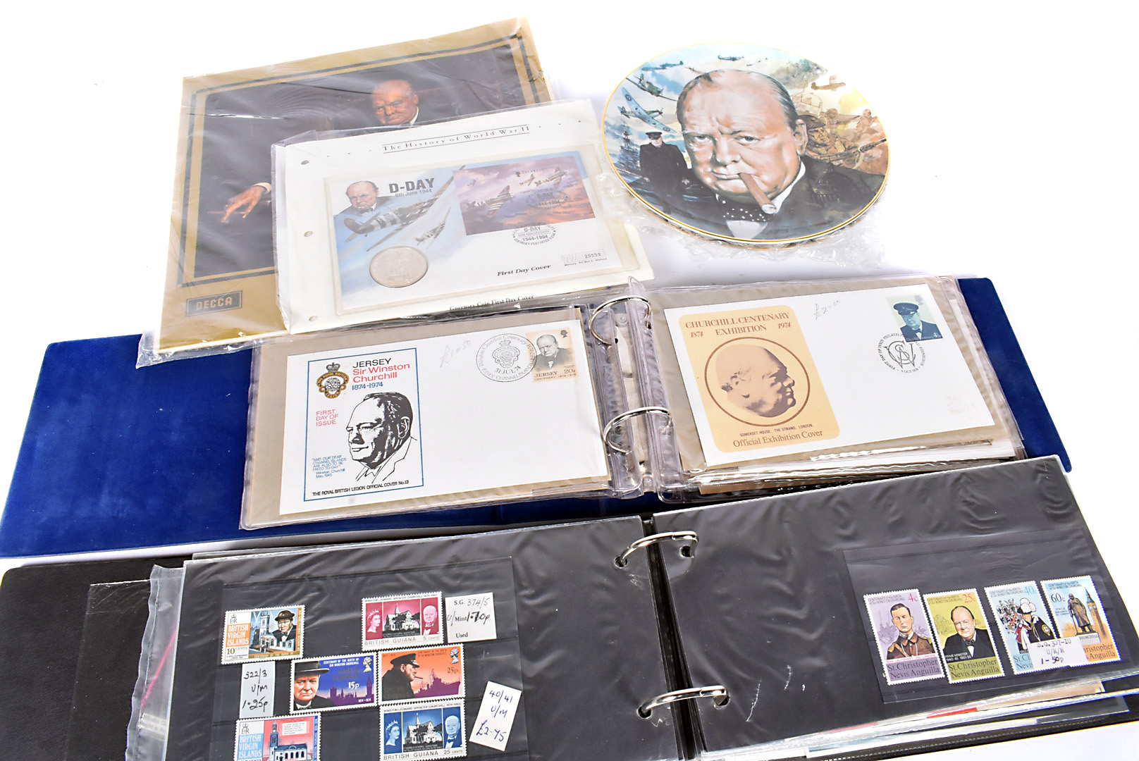 An assortment of Winston Churchill reated items, comprising First Day Covers, Commemorative coins,