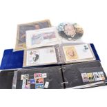 An assortment of Winston Churchill reated items, comprising First Day Covers, Commemorative coins,
