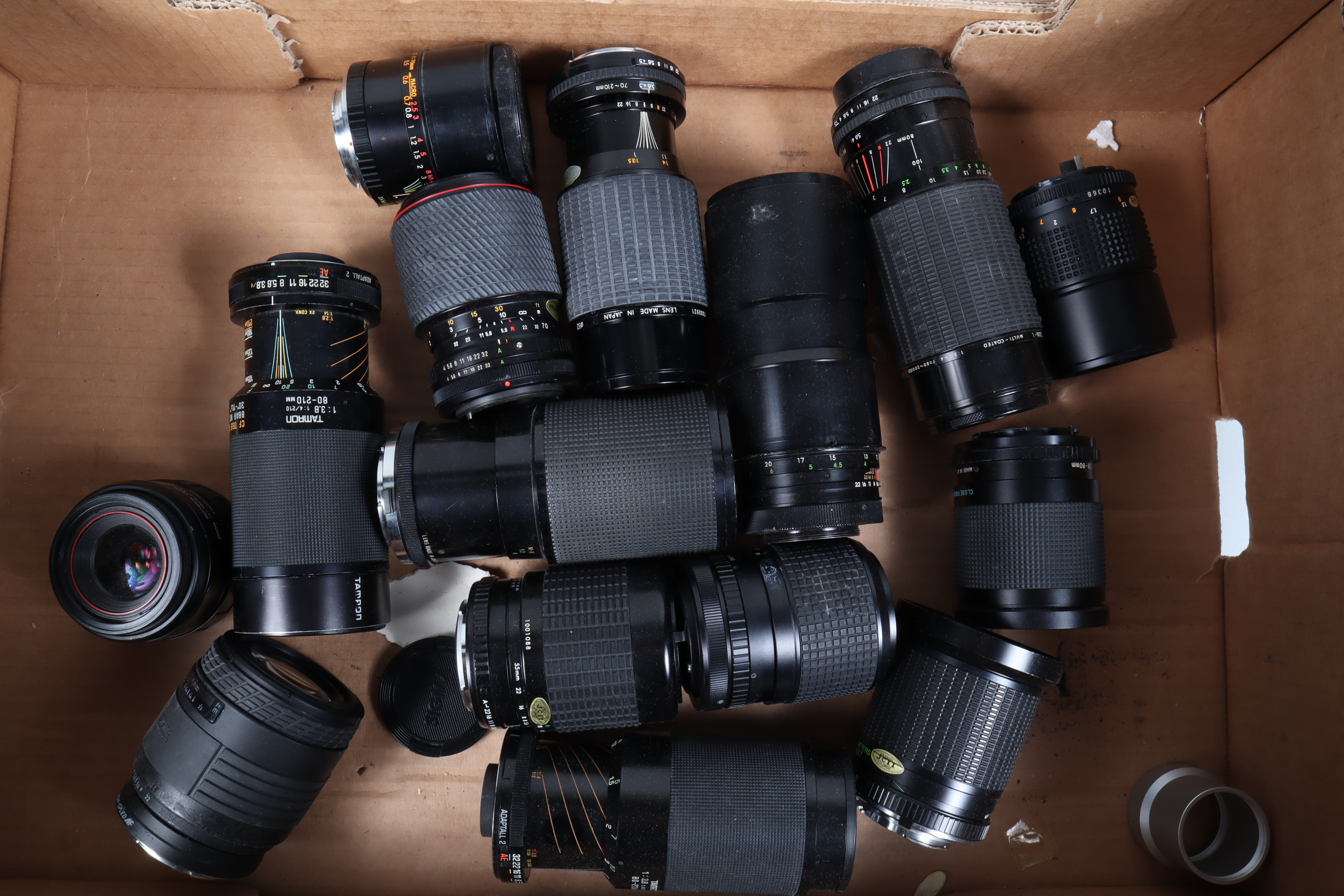 A Tray of Zoom Lenses, various mounts and focal lengths, some auto focus examples, manufacturers