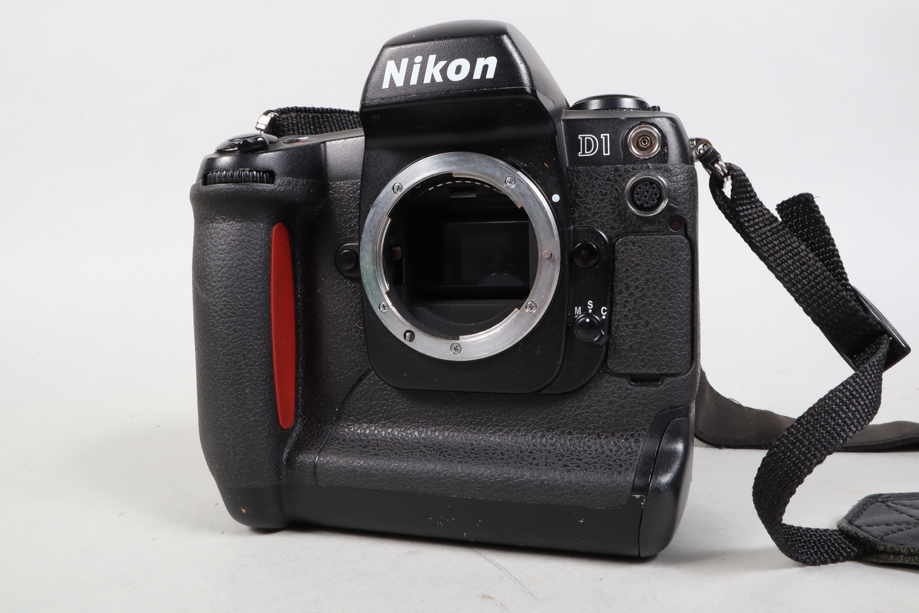 Nikon D1 DSLR body, serial no. 5027417, fair, part of covering missing, untested, as found