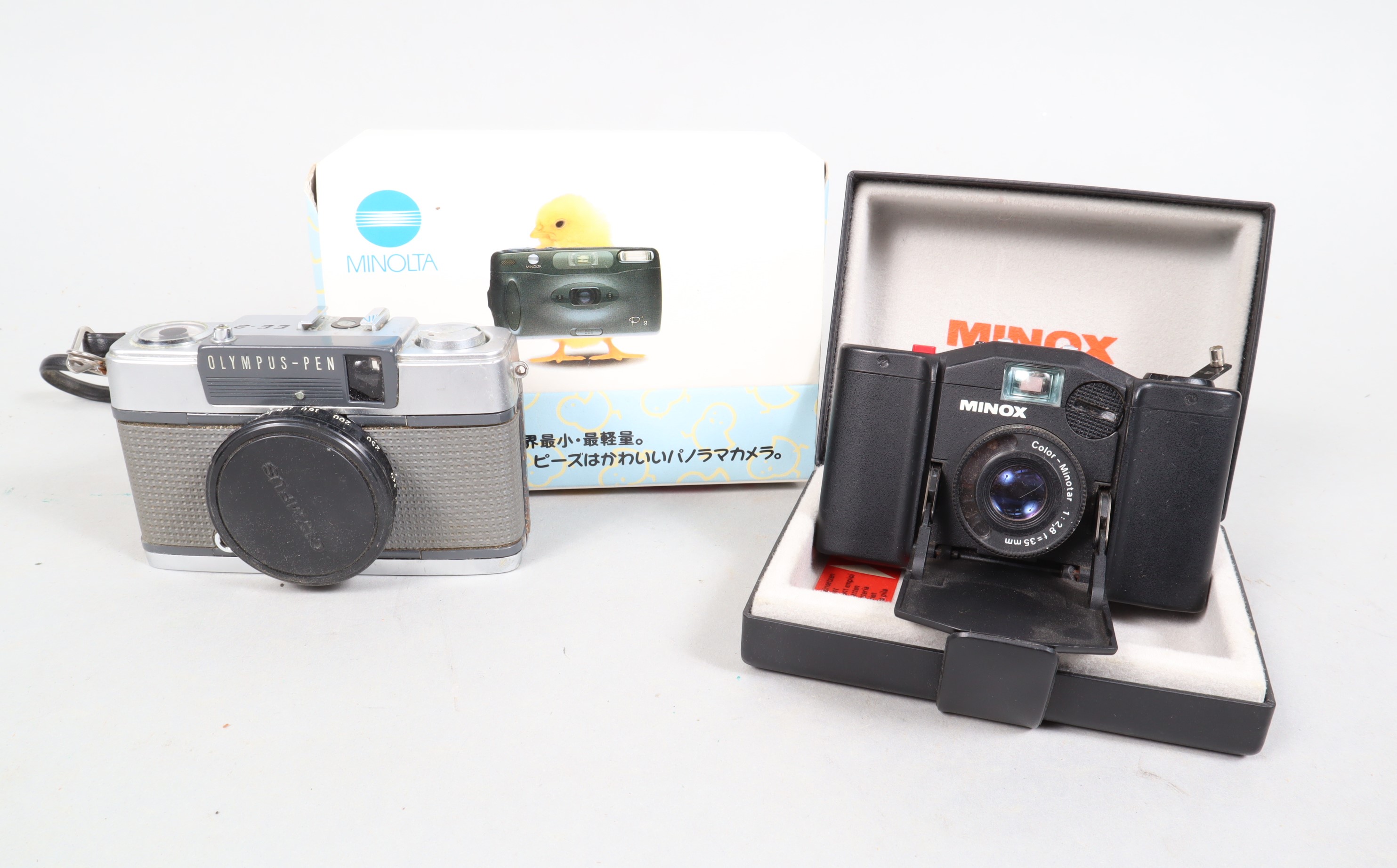 Compact Cameras, comprising a Minox 35 EL with maker's presentation box and instructions, an Olympus