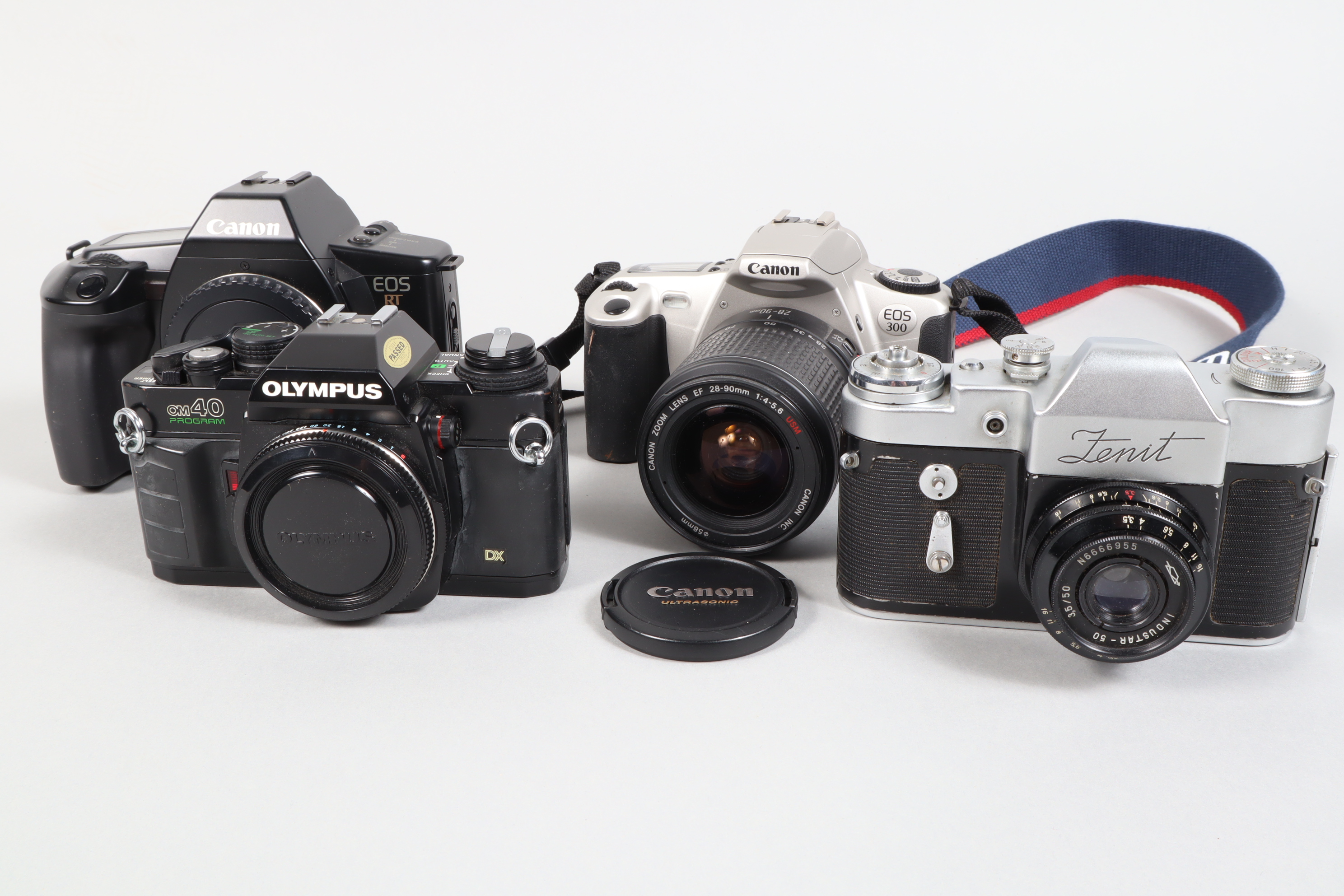 A Group of SLR Cameras, a Zenit 3, shutter working, body G, with Industar-50 50mm f/3.5 lens,