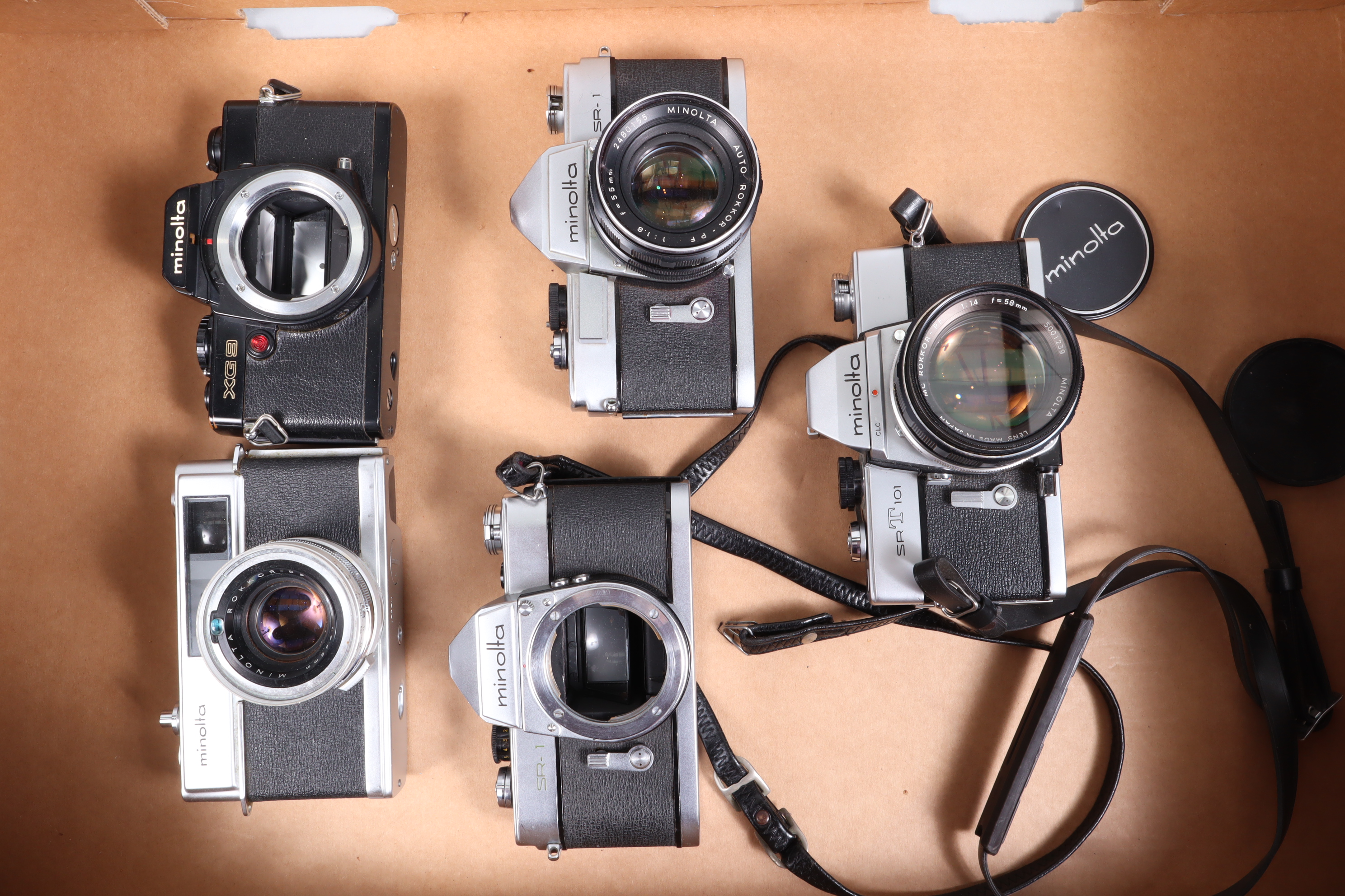 A Tray of Minolta Cameras, a Minolta SR-1, shutter working,body G, with 55mm f/1.8 Auto Rokker lens,