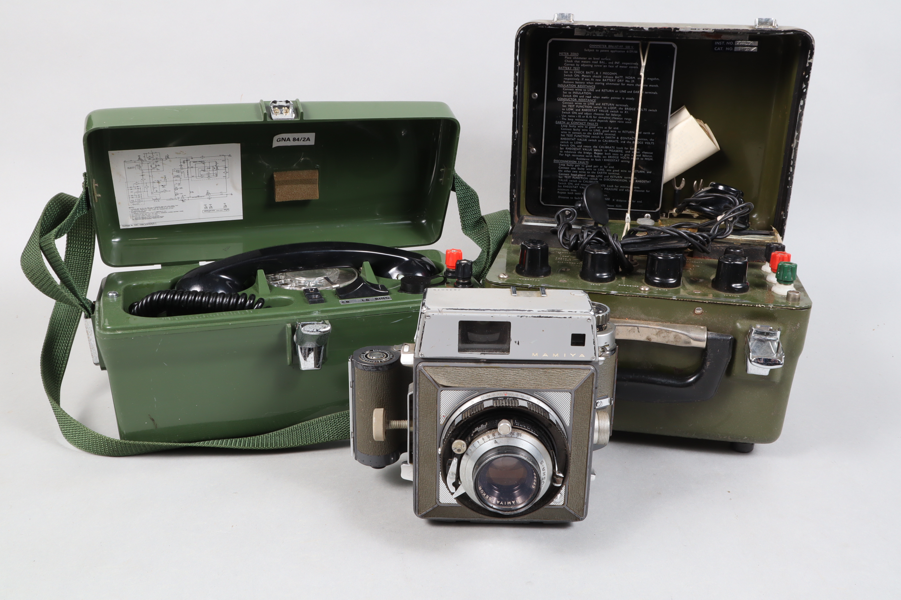 A Mamiya Press G 6 x 9 Camera, with roll-film back, poor, shutter working, lens fair; with BR