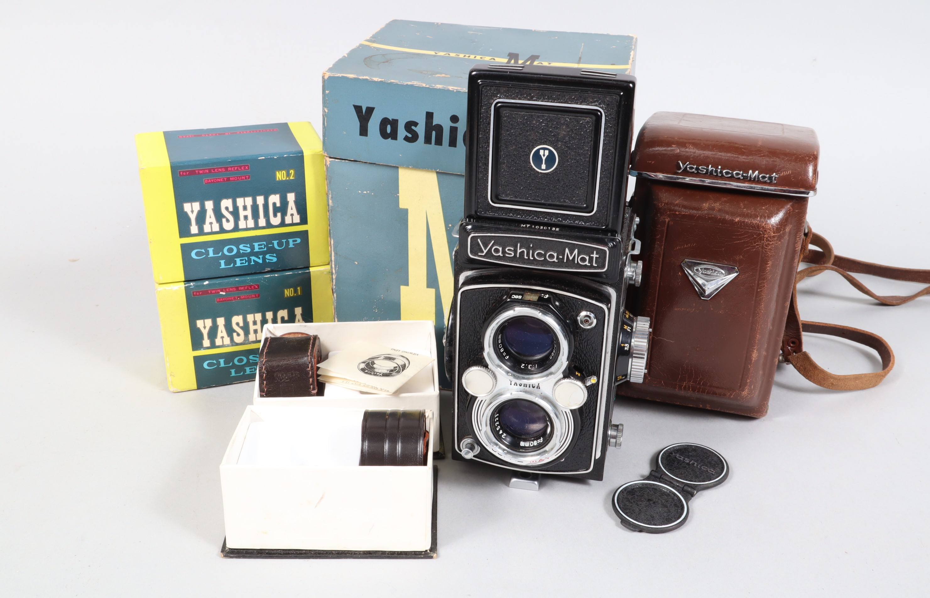 A Yashica Mat TLR Camera, serial no MT 1030132, shutter working, body G-VG, some wear to edges, with
