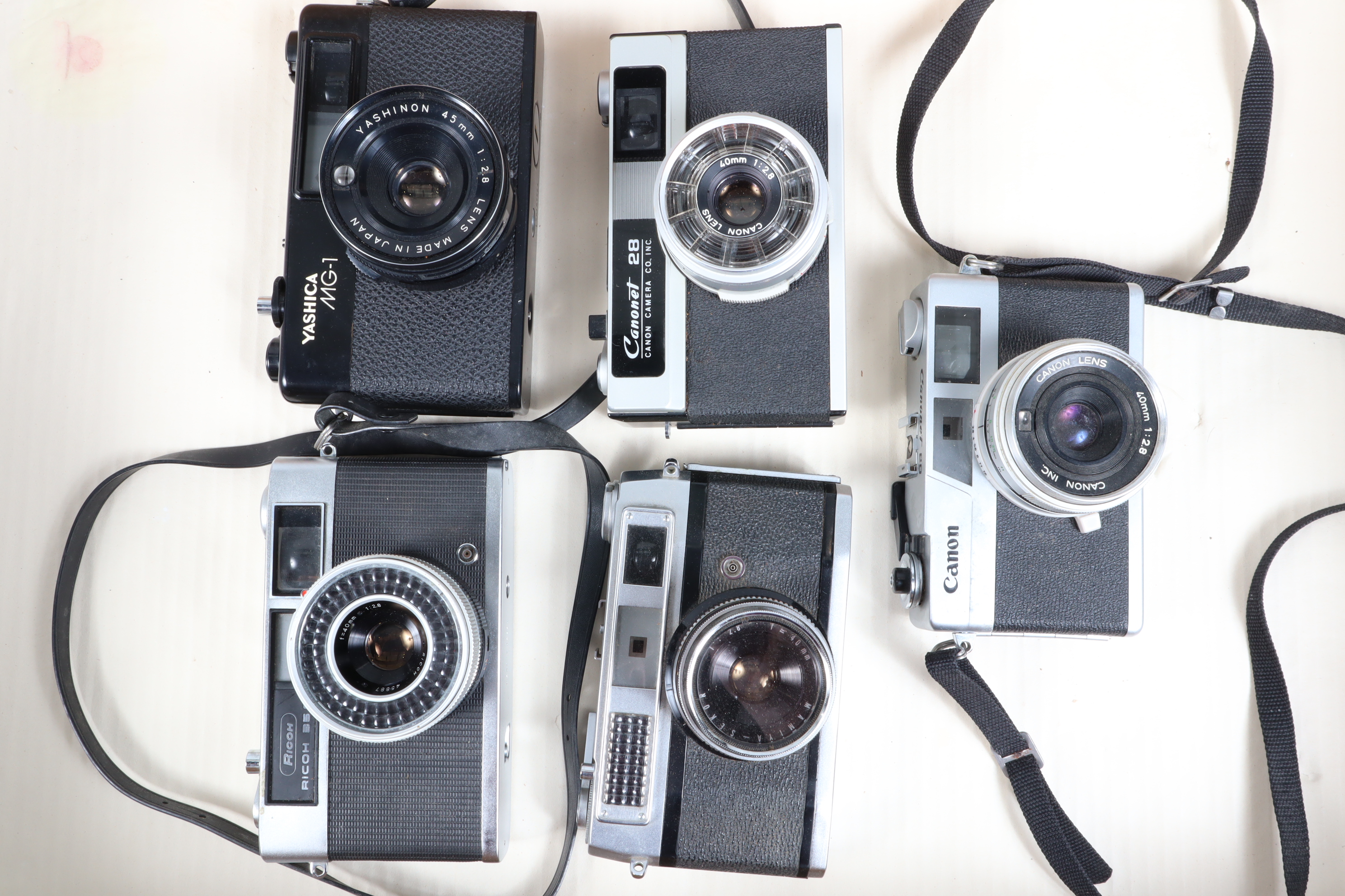 A Group of Rangefinder Cameras, a Yashica MG-1, untested, with 45mm f/2.8 lens, G, a Rocoh 35 S, A/